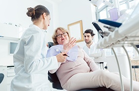 Patient talking with dental team during consultation