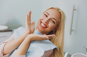 Happy dental patient showing off her healthy smile