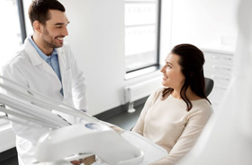 Dentist and patient conversing about sedation options