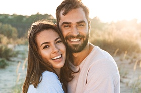 Happy, smiling couple enjoying benefits of tooth-colored fillings
